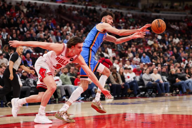 Chicago Bulls guard Collin Sexton (2) chases Oklahoma City Thunder center Chet Holmgren (7) while he passes the ball during the first quarter at the United Center March 3, 2026 in Chicago. (Armando L. Sanchez/Chicago Tribune)