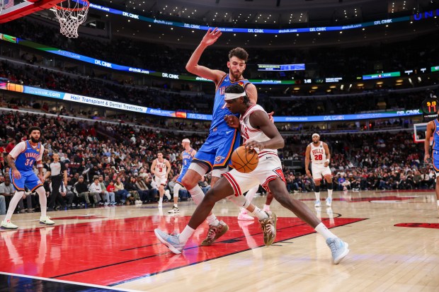 Chicago Bulls forward Leonard Miller (11) drives against Oklahoma City Thunder center Chet Holmgren (7) during the second quarter at the United Center March 3, 2026 in Chicago. (Armando L. Sanchez/Chicago Tribune)