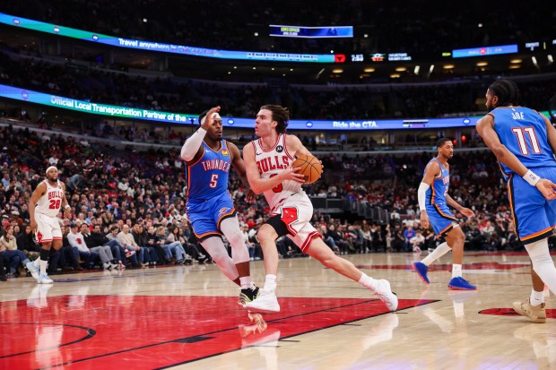 Chicago Bulls guard Josh Giddey (3) drives against Oklahoma City Thunder guard Luguentz Dort (5) during the second quarter at the United Center March 3, 2026 in Chicago. (Armando L. Sanchez/Chicago Tribune)
