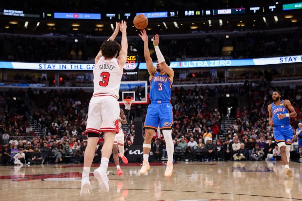 Oklahoma City Thunder guard Jared McCain (3) shoots a three-point basket over Chicago Bulls guard Josh Giddey (3) during the third quarter at the United Center March 3, 2026 in Chicago. (Armando L. Sanchez/Chicago Tribune)