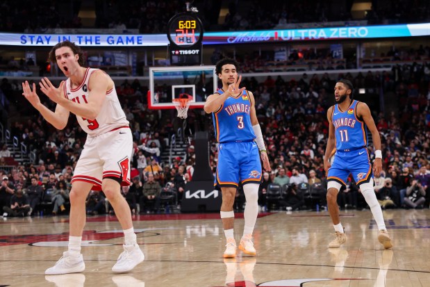 Oklahoma City Thunder guard Jared McCain (3) gestures towards the Chicago Bulls bench after making a three-point basket over Chicago Bulls guard Josh Giddey (3) during the third quarter at the United Center March 3, 2026 in Chicago. (Armando L. Sanchez/Chicago Tribune)
