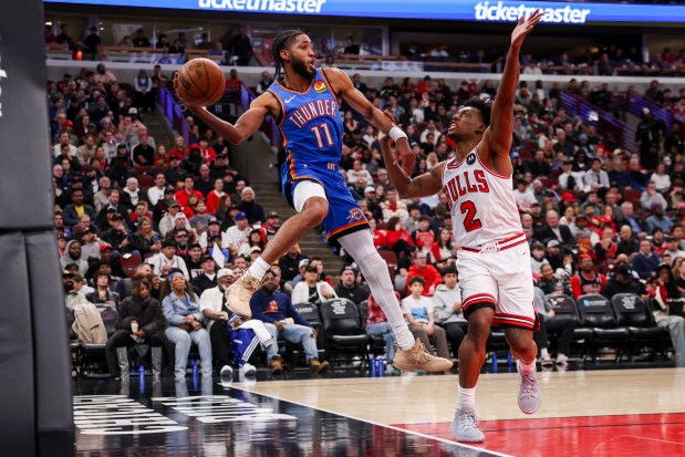 Chicago Bulls guard Collin Sexton (2) guards Oklahoma City Thunder guard Isaiah Joe (11) while he saves a ball from going out-of-bounds during the third quarter at the United Center March 3, 2026 in Chicago. (Armando L. Sanchez/Chicago Tribune)