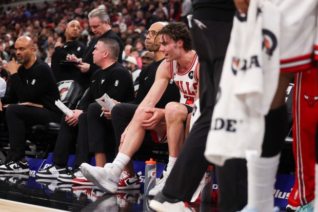Chicago Bulls guard Josh Giddey (3) grabs his ankle on the bench during the third quarter against the Oklahoma City Thunder at the United Center March 3, 2026 in Chicago. (Armando L. Sanchez/Chicago Tribune)