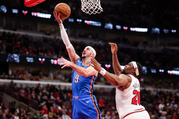 Oklahoma City Thunder guard Alex Caruso (9) goes up for a basket past Chicago Bulls forward Guerschon Yabusele (28) during the fourth quarter at the United Center March 3, 2026 in Chicago. (Armando L. Sanchez/Chicago Tribune)