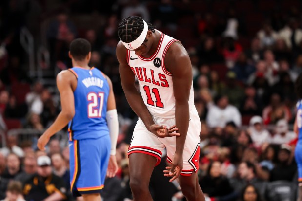 Bulls forward Leonard Miller celebrates after making a 3-pointer against the Thunder on March 3, 2026, at the United Center. (Armando L. Sanchez/Chicago Tribune)