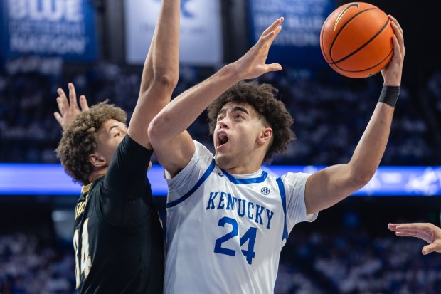 Malachi Moreno of the Kentucky Wildcats shoots the ball against Jayden Leverett of the Vanderbilt Commodores during the second half at Rupp Arena on Feb. 28, 2026, in Lexington, Kentucky. (Michael Hickey/Getty Images)