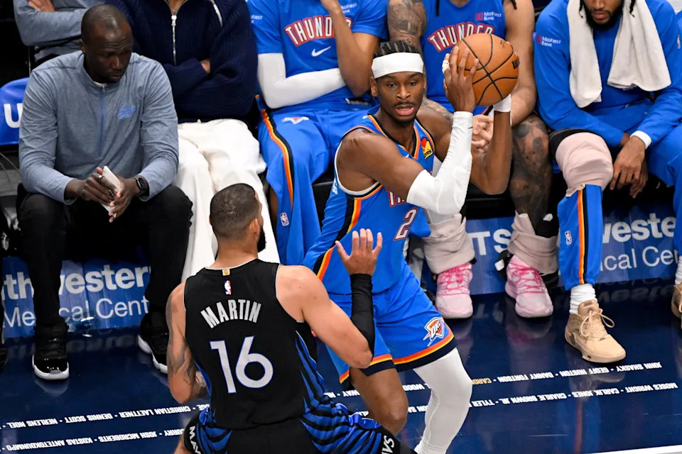 Mar 1, 2026; Dallas, Texas, USA; Oklahoma City Thunder guard Shai Gilgeous-Alexander (2) looks to move the ball past Dallas Mavericks forward Caleb Martin (16) during the first quarter at the American Airlines Center. Mandatory Credit: Jerome Miron-Imagn Images