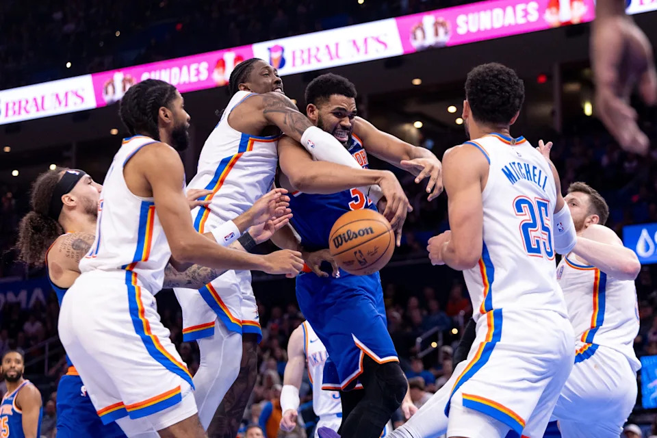 OKLAHOMA CITY, OKLAHOMA - MARCH 29: Jalen Williams #8 of the Oklahoma City Thunder gets tangled up with Karl-Anthony Towns #32 of the New York Knicks during the second half at Paycom Center on March 29, 2026 in Oklahoma City, Oklahoma. NOTE TO USER: User expressly acknowledges and agrees that, by downloading and or using this photograph, User is consenting to the terms and conditions of the Getty Images License Agreement. (Photo by William Purnell/Getty Images)