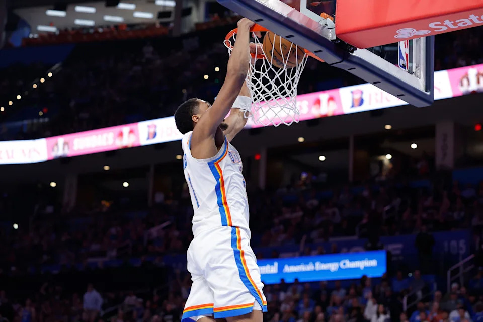 Mar 30, 2026; Oklahoma City, Oklahoma, USA; Oklahoma City Thunder guard Aaron Wiggins (21) dunks against the Detroit Pistons during the second half at Paycom Center. Mandatory Credit: Alonzo Adams-Imagn Images