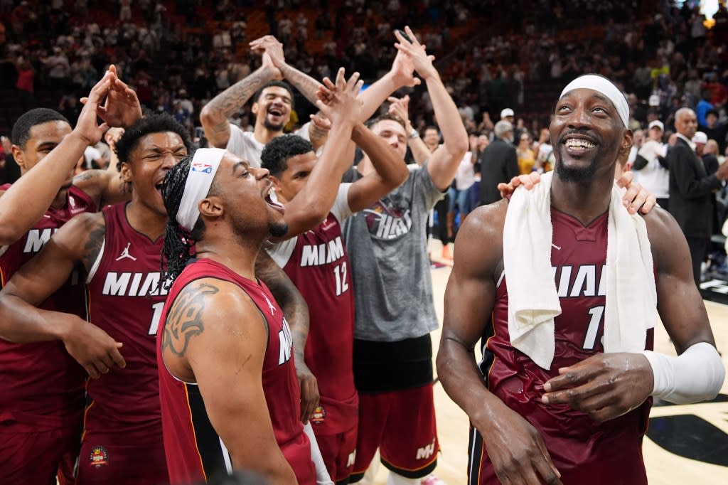 Bam Adebayo (right) celebrates with teammates after he scored 83 points, the second-highest single game total in NBA history. AP