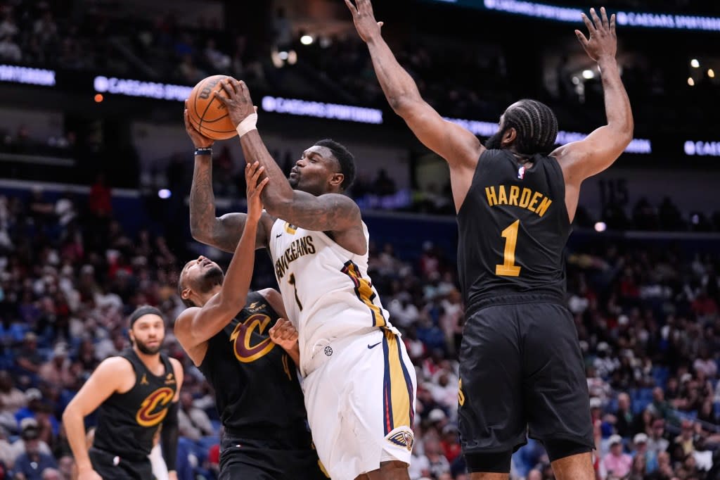 Zion Williamson (1) drives to the basket against Cleveland Cavaliers center Evan Mobley (4) and guard James Harden (1) in the second half of an NBA basketball game, Saturday, March 21, 2026, in New Orleans. AP