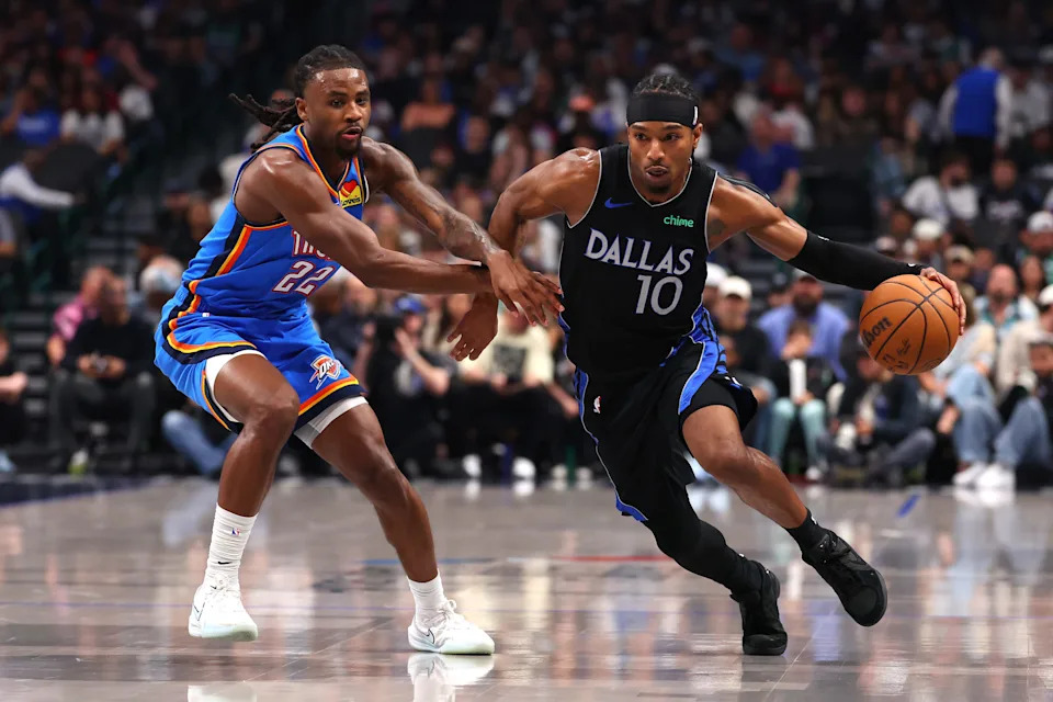 DALLAS, TEXAS - MARCH 01: Brandon Williams #10 of the Dallas Mavericks is defended by Cason Wallace #22 of the Oklahoma City Thunder during the first quarter at American Airlines Center on March 01, 2026 in Dallas, Texas. NOTE TO USER: User expressly acknowledges and agrees that, by downloading and or using this photograph, user is consenting to the terms and conditions of the Getty Images License Agreement. (Photo by Sam Hodde/Getty Images)