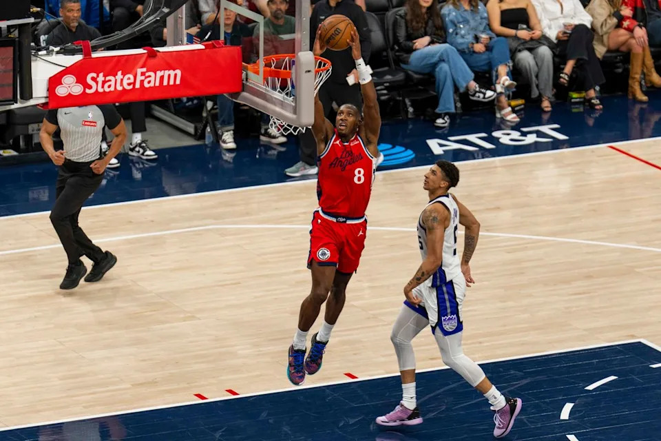 Los Angeles Clippers guard Kris Dunn (8) finishes the fast break dunk during an NBA basketball game against the Sacramento Kings, Saturday March 14th, 2026 in Los Angeles, California.