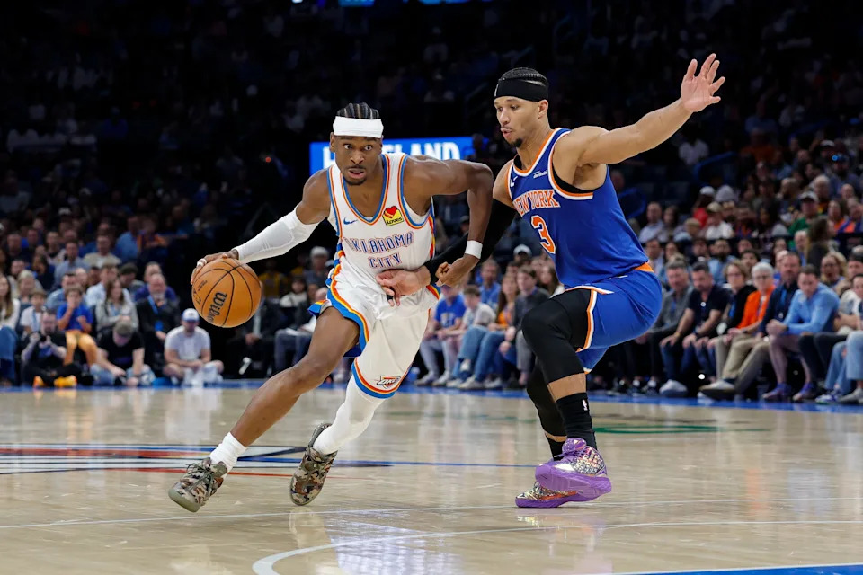 Mar 29, 2026; Oklahoma City, Oklahoma, USA; Oklahoma City Thunder guard Shai Gilgeous-Alexander (2) drives around New York Knicks guard Josh Hart (3) during the second half at Paycom Center. Mandatory Credit: Alonzo Adams-Imagn Images