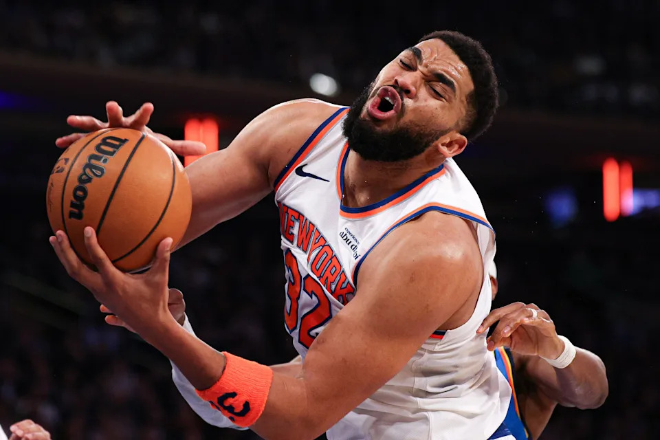 Mar 4, 2026; New York, New York, USA; New York Knicks center Karl-Anthony Towns (32) rebounds against Oklahoma City Thunder guard Shai Gilgeous-Alexander (2) during the second half at Madison Square Garden. Mandatory Credit: Vincent Carchietta-Imagn Images