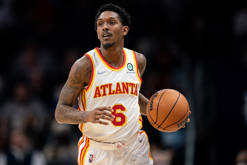 Lou Williams dribbling the basketball in his left hand