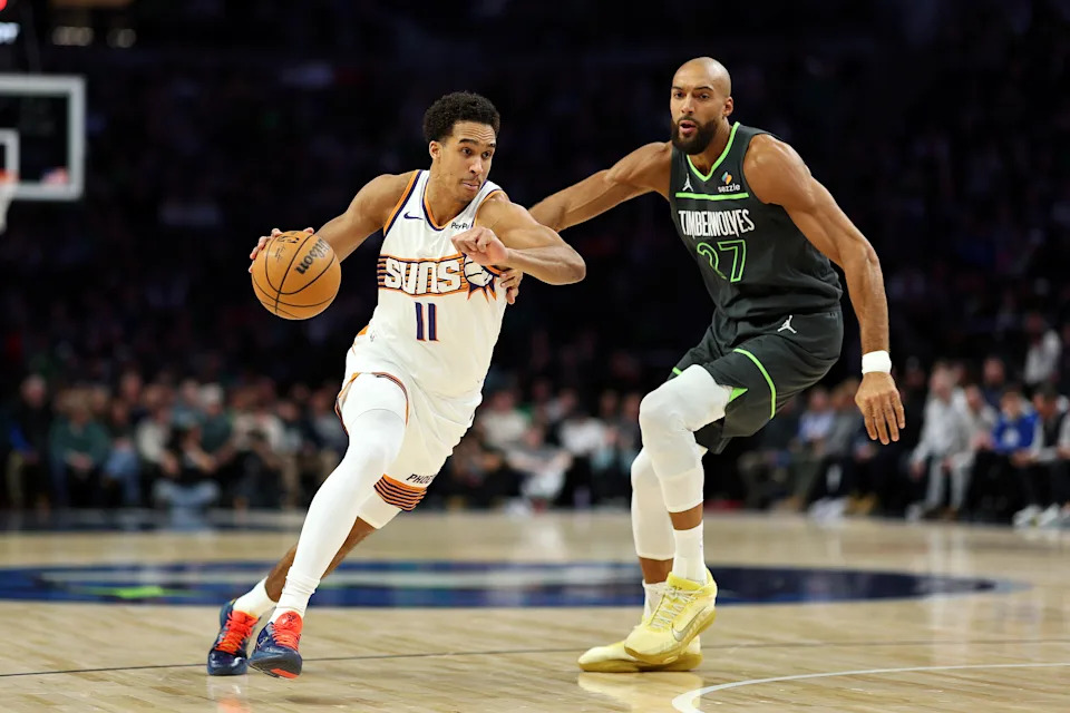 MINNEAPOLIS, MINNESOTA – MARCH 17: Oso Ighodaro #11 of the Phoenix Suns goes to the basket against Rudy Gobert #27 of the Minnesota Timberwolves in the first quarter at Target Center on March 17, 2026 in Minneapolis, Minnesota. NOTE TO USER: User expressly acknowledges and agrees that, by downloading and or using this photograph, User is consenting to the terms and conditions of the Getty Images License Agreement. (Photo by David Berding/Getty Images) | Getty Images