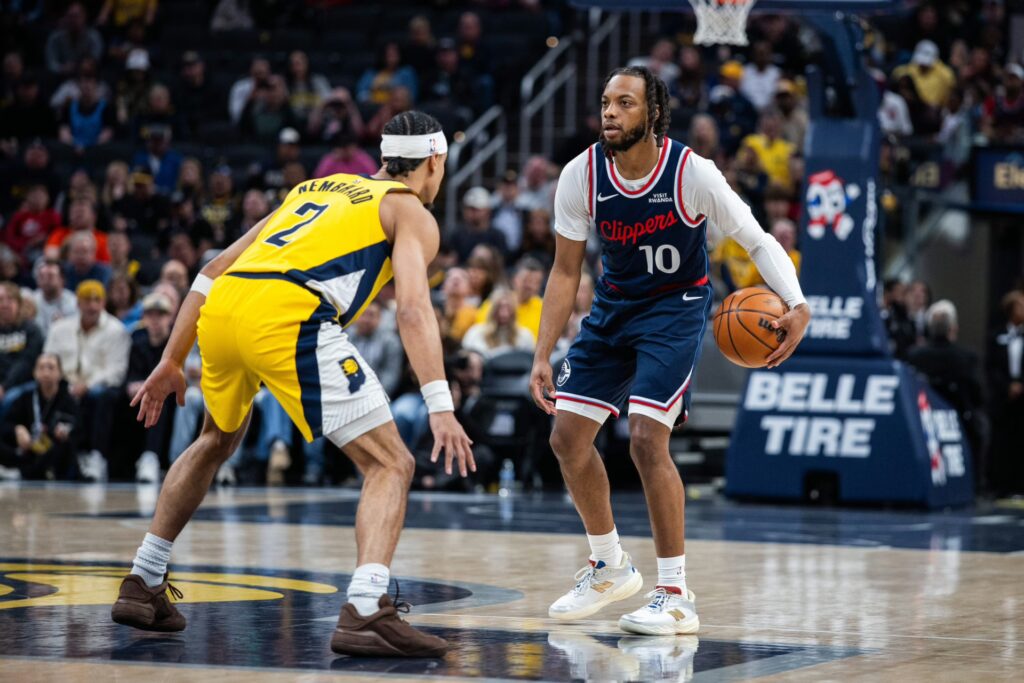 LA Clippers guard Darius Garland (10) dribbles against Indiana Pacers guard Andrew Nembhard (2) in the first half at Gainbridge Fieldhouse.