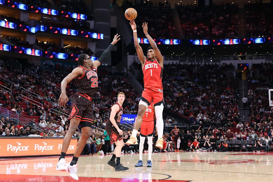 Jan 13, 2026; Houston, Texas, USA; Houston Rockets guard Amen Thompson (1) shoots the ball as Chicago Bulls forward Jalen Smith (25) defends during the second half at Toyota Center. Mandatory Credit: Troy Taormina-Imagn Images
