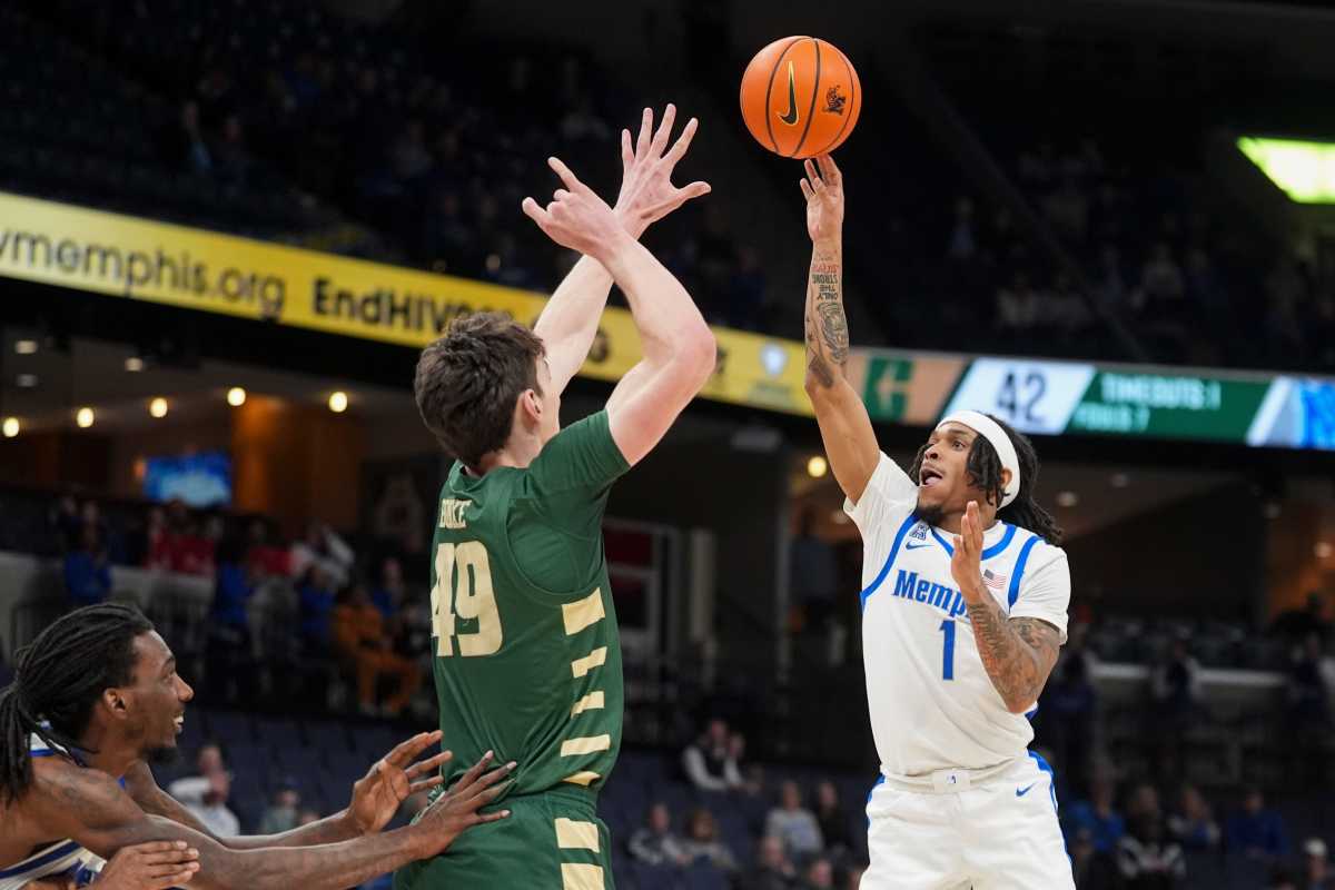Memphis' Dug McDaniel (1) shoots the ball as Charlotte's Anton Bonke (49) guards him.© Chris Day&sol;The Commercial Appeal &sol; USA TODAY NETWORK via Imagn Images