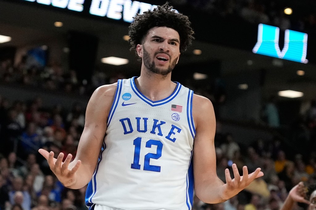 Duke forward Cameron Boozer reacts to a foul during the first half against TCU in the NCAA college basketball tournament.