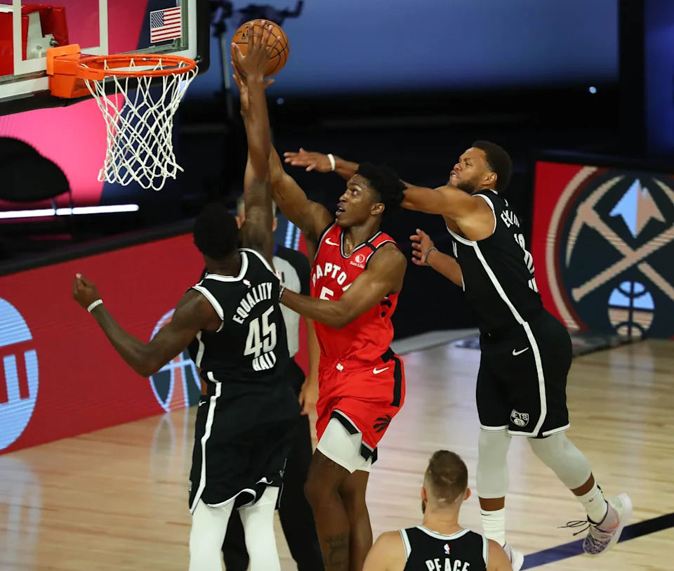 Aug 23, 2020; Lake Buena Vista, Florida, USA; Brooklyn Nets forward Donta Hall (45) blocks a shot against Toronto Raptors forward Stanley Johnson (5) during the second half in game four of the first round of an NBA game in the 2020 NBA Playoffs at The Field House. Mandatory Credit: Kim Klement-USA TODAY Sports