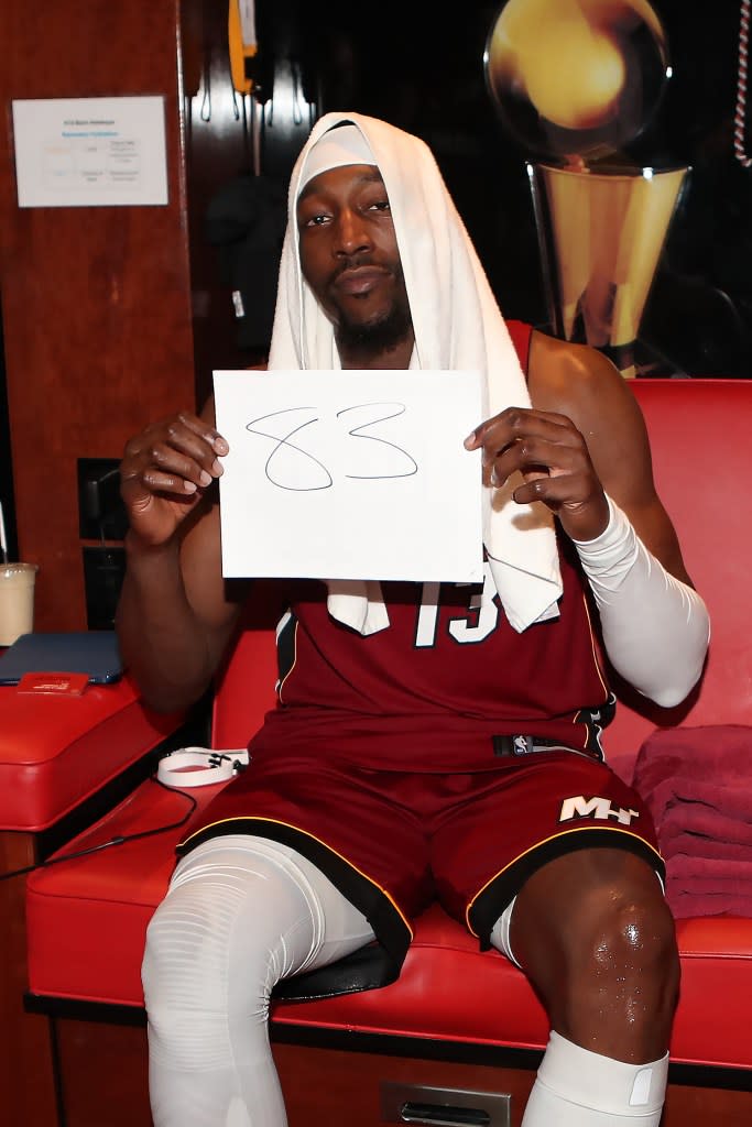 Bam Adebayo poses for a photo holding up a sign after scoring 83 points in the Heat’s blowout win over the <br>Wizards on March 12, 2026. NBAE via Getty Images