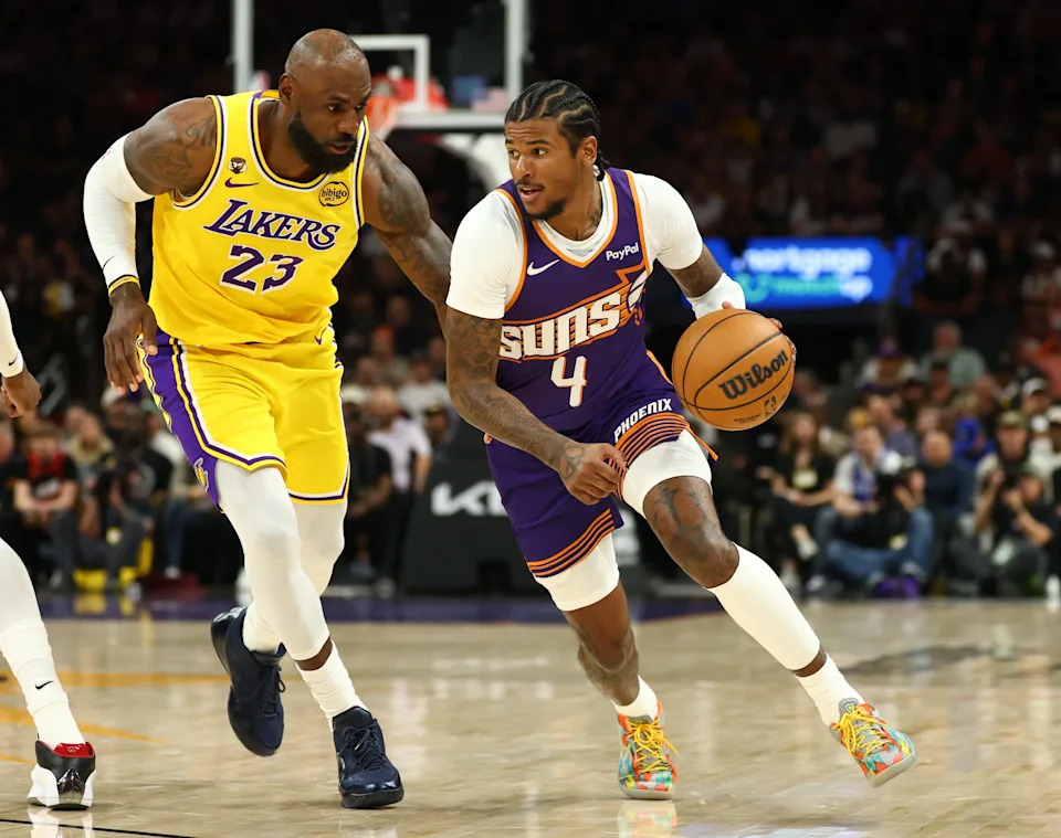 Feb 26, 2026; Phoenix, Arizona, USA; Los Angeles Lakers forward LeBron James (23) defends against Phoenix Suns guard Jalen Green (4) in the first half at Mortgage Matchup Center. Mandatory Credit: Mark J. Rebilas-Imagn Images