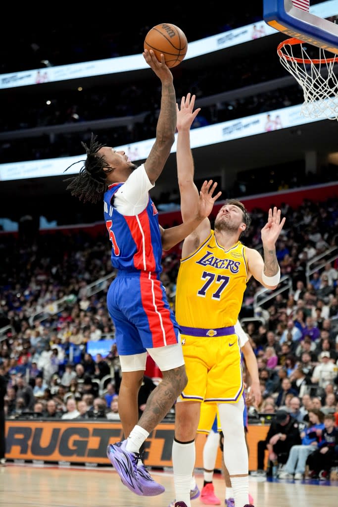 Detroit’s Ronald Holland shoots against LA’s Luka Dončić at Little Caesars Arena, March 23 in Detroit, Michigan. Getty Images