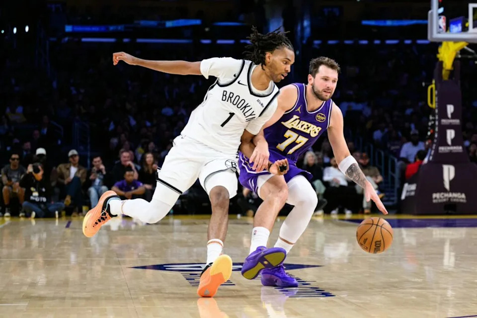 Los Angeles Lakers guard Luka Doncic (77) drives against Brooklyn Nets forward Ziaire Williams (1) during the second half at Crypto.com Arena.