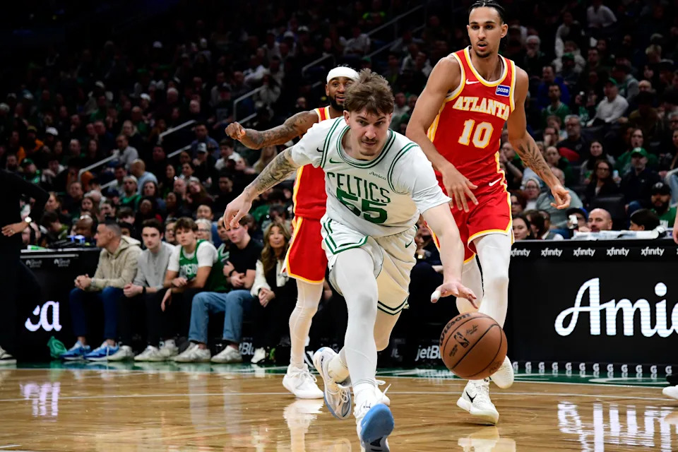 Mar 27, 2026; Boston, Massachusetts, USA;Boston Celtics guard Baylor Scheierman (55) tries to gain control of the ball during the second half against the Atlanta Hawks at TD Garden. Mandatory Credit: Bob DeChiara-Imagn Images