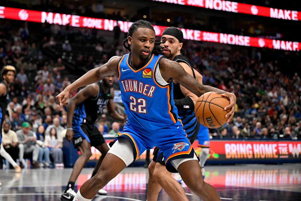 Mar 1, 2026; Dallas, Texas, USA; Oklahoma City Thunder guard Cason Wallace (22) looks to move the ball past Dallas Mavericks guard Ryan Nembhard (9) during the second half at the American Airlines Center. Mandatory Credit: Jerome Miron-Imagn Images