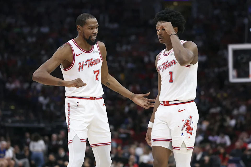 Mar 5, 2026; Houston, Texas, USA; Houston Rockets forward Kevin Durant (7) talks with guard Amen Thompson (1) during the fourth quarter against the Golden State Warriors at Toyota Center. Mandatory Credit: Troy Taormina-Imagn Images