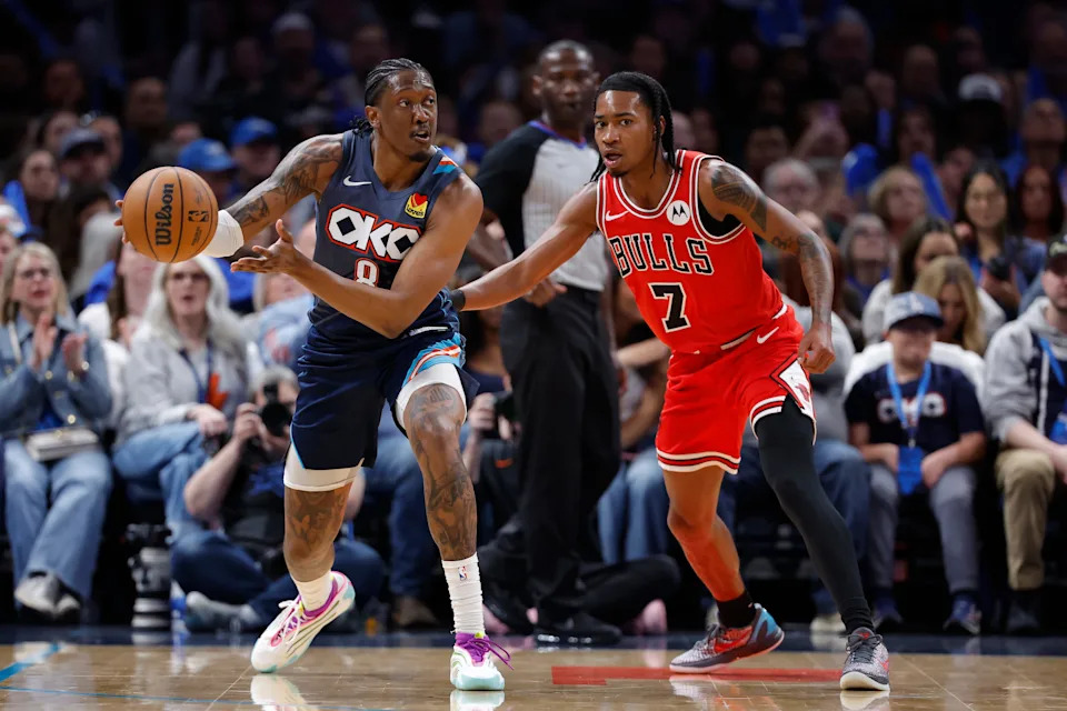 Mar 27, 2026; Oklahoma City, Oklahoma, USA; Oklahoma City Thunder guard Jalen Williams (8) passes around Chicago Bulls guard Rob Dillingham (7) during the second half at Paycom Center. Mandatory Credit: Alonzo Adams-Imagn Images