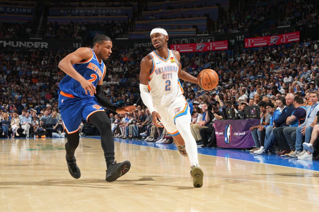 Shai Gilgeous-Alexander #2 of the Oklahoma City Thunder dribbles the ball against Miles McBride on March 29, 2026. NBAE via Getty Images