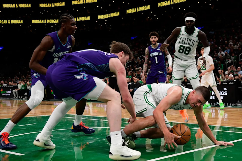 Mar 4, 2026; Boston, Massachusetts, USA; Boston Celtics guard Payton Pritchard (11) loses control of the ball while Charlotte Hornets guard Kon Knueppel (7) defends during the first half at TD Garden. Mandatory Credit: Bob DeChiara-Imagn Images