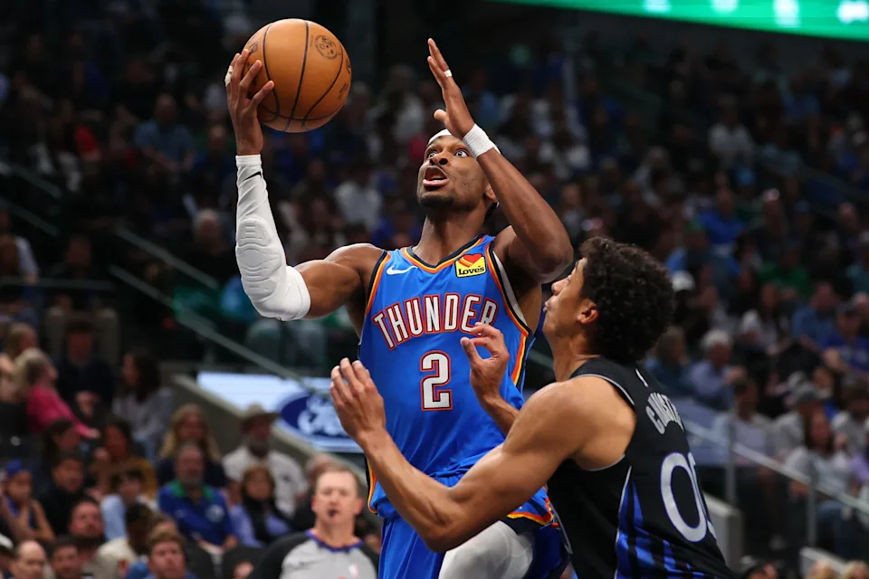 DALLAS, TEXAS - MARCH 01: Shai Gilgeous-Alexander #2 of the Oklahoma City Thunder goes to the basket against Max Christie #00 of the Dallas Mavericks during the third quarter at American Airlines Center on March 01, 2026 in Dallas, Texas. NOTE TO USER: User expressly acknowledges and agrees that, by downloading and or using this photograph, user is consenting to the terms and conditions of the Getty Images License Agreement. (Photo by Sam Hodde/Getty Images)