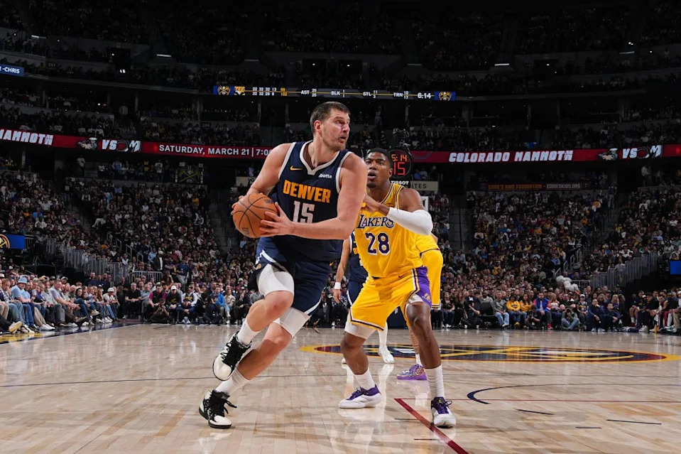 Nikola Jokic drives to the basket against the Lakers. NBAE via Getty Images