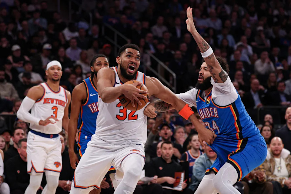 Mar 4, 2026; New York, New York, USA; New York Knicks center Karl-Anthony Towns (32) goes to the basket against Oklahoma City Thunder guard Kenrich Williams (34) during the second half at Madison Square Garden. Mandatory Credit: Vincent Carchietta-Imagn Images