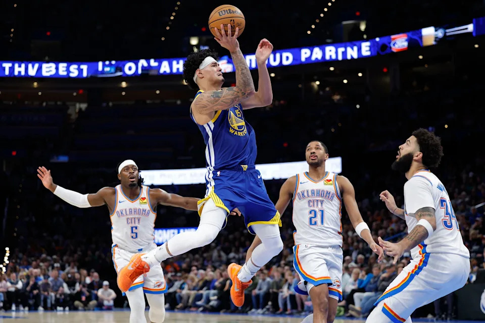 Mar 7, 2026; Oklahoma City, Oklahoma, USA; Golden State Warriors forward Gui Santos (15) goes up for a basket between Oklahoma City Thunder guard Luguentz Dort (5), guard Aaron Wiggins (21), and guard/forward Kenrich Williams (34) during the second half at Paycom Center. Mandatory Credit: Alonzo Adams-Imagn Images