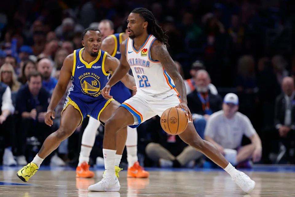 Mar 7, 2026; Oklahoma City, Oklahoma, USA; Oklahoma City Thunder guard Cason Wallace (22) drives past Golden State Warriors guard Lj Cryer (18) during the second half at Paycom Center. Mandatory Credit: Alonzo Adams-Imagn Images