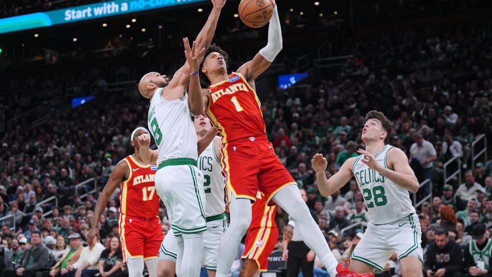 Atlanta Hawks forward Jalen Johnson drives to the basket against the Boston Celtics center during the second half of an NBA basketball game, Friday, March 27, 2026, in Boston. (AP Photo/Charles Krupa)