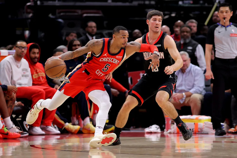 Mar 13, 2026; Houston, Texas, USA; New Orleans Pelicans guard Dejounte Murray (5) handles the ball against Houston Rockets guard Reed Sheppard (15) during the second quarter at Toyota Center. Mandatory Credit: Erik Williams-Imagn Images