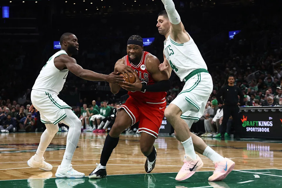 Feb 11, 2026; Boston, Massachusetts, USA; Chicago Bulls forward Guerschon Yabusele (28) tries to get between Boston Celtics center Nikola Vucevic (4) and guard Jaylen Brown (7) during the second half at TD Garden. Mandatory Credit: Winslow Townson-Imagn Images