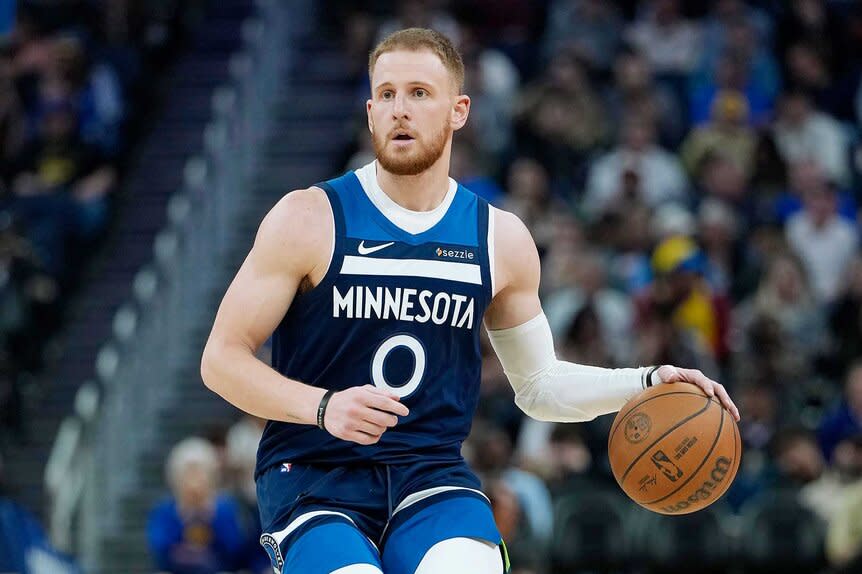 Donte DiVincenzo of the Minnesota Timberwolves dribbles the ball against the Golden State Warriors.
