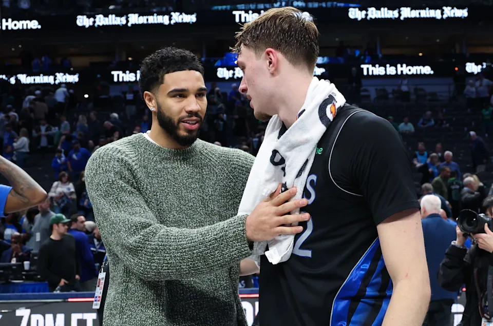 Feb 3, 2026; Dallas, Texas, USA; Dallas Mavericks forward Cooper Flagg (32) hugs Boston Celtics forward Jayson Tatum after the game at American Airlines Center. Mandatory Credit: Kevin Jairaj-Imagn Images
