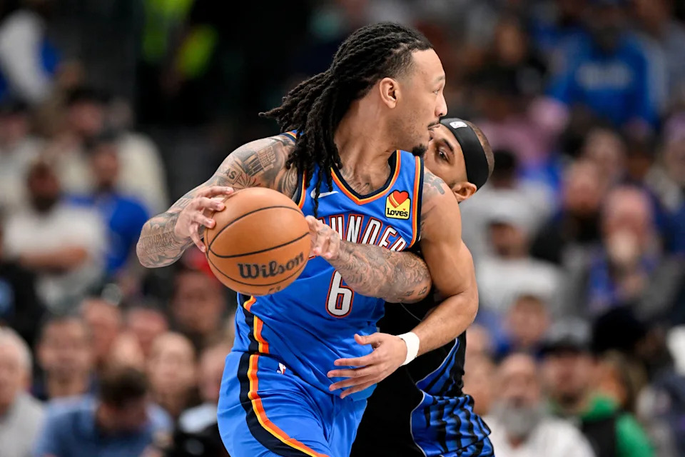 Mar 1, 2026; Dallas, Texas, USA; Oklahoma City Thunder forward Jaylin Williams (6) looks to move the ball past Dallas Mavericks forward Daniel Gafford (21) during the second quarter at the American Airlines Center. Mandatory Credit: Jerome Miron-Imagn Images