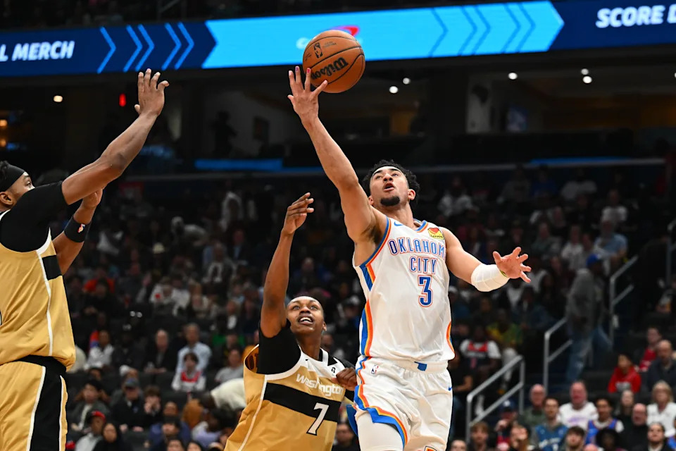 Mar 21, 2026; Washington, District of Columbia, USA; Washington Wizards guard Bub Carrington (7) fouls Oklahoma City Thunder guard Jared McCain (3) during the second half at Capital One Arena. Mandatory Credit: Brad Mills-Imagn Images