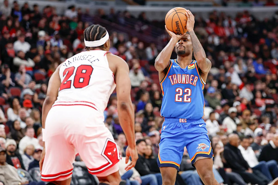Mar 3, 2026; Chicago, Illinois, USA; Oklahoma City Thunder guard Cason Wallace (22) shoots against Chicago Bulls forward Guerschon Yabusele (28) during the second half at United Center. Mandatory Credit: Kamil Krzaczynski-Imagn Images