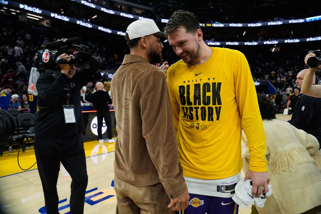Golden State Warriors’ Stephen Curry, left, speaks to Los Angeles Lakers guard Luka Doncic, right, after an NBA basketball game, Saturday, Feb. 28, 2026, in San Francisco. (AP Photo/Godofredo A. Vásquez) AP